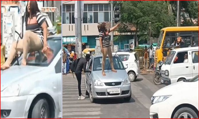 Drunk girl dances on moving car in Gwalior