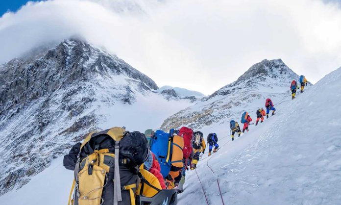 10 Nepalese guides climbed Everest