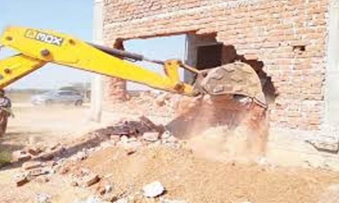 Demolition of illegal constructions in Gandipet