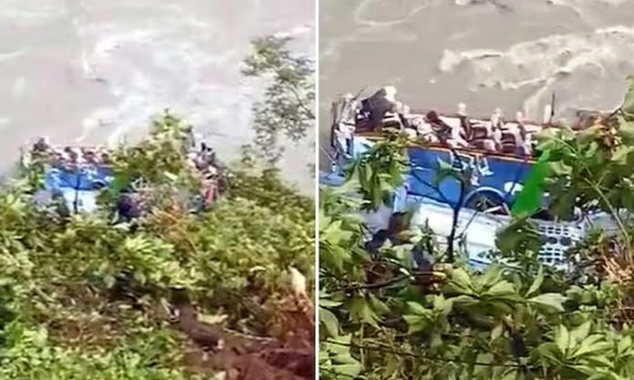 Bus plunges into river