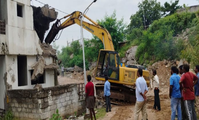 Demolition of illegal villas in Manikonda