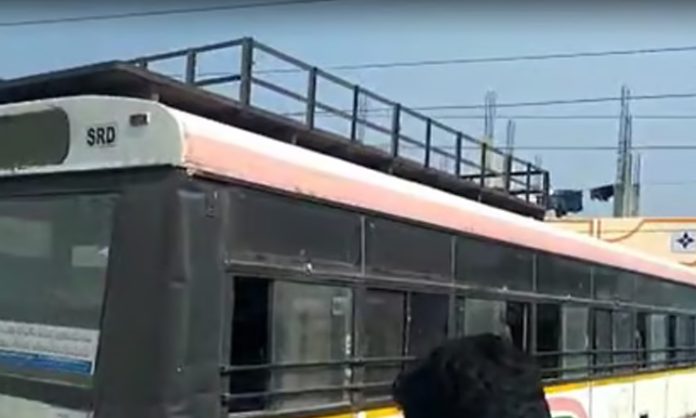 An electric cable falling on an RTC bus