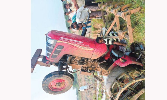 Farmer dies after stuck between tractor and plough